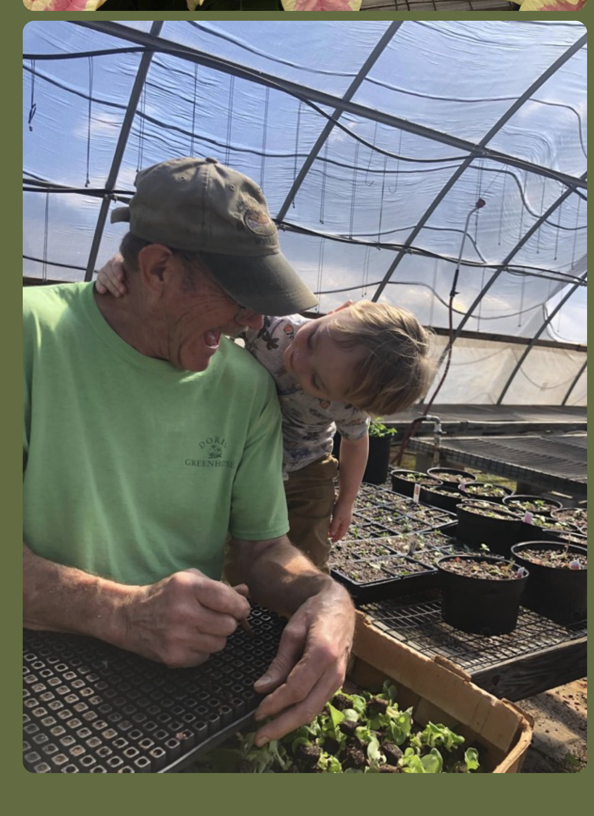 Grandfather and grandchild learning together in Doris Greenhouse — passing down a love of growing